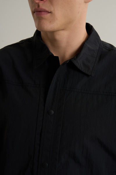 �������� ANTA COMMUTE Woven Track Top