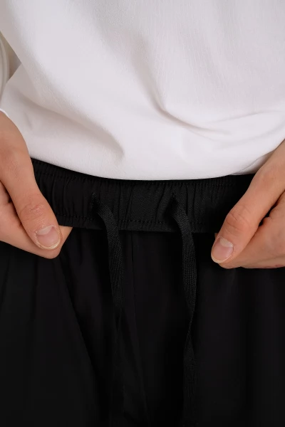 ����� ����������� ����������� Anta RUNNING Woven Ankle Pants
