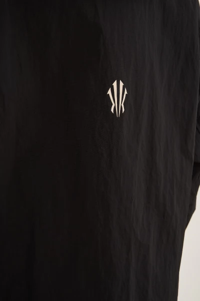 �������� ANTA KAI Woven Track Top